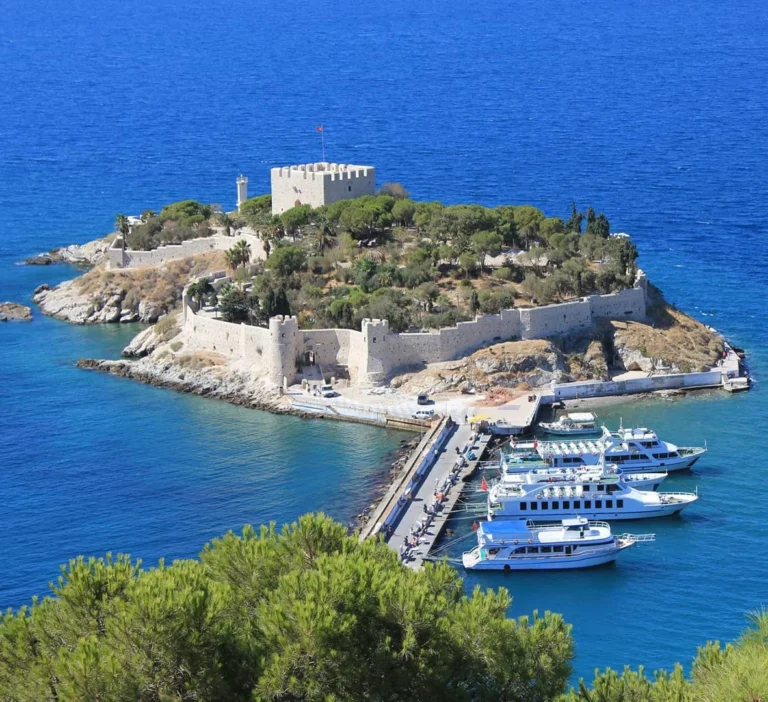 Pigeon Island in Kusadasi with castle and marina view on the Aegean coast