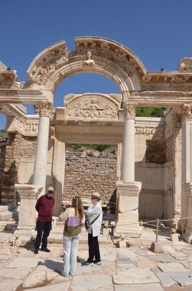 Tourists visiting the Temple of Hadrian in Ephesus Ancient City