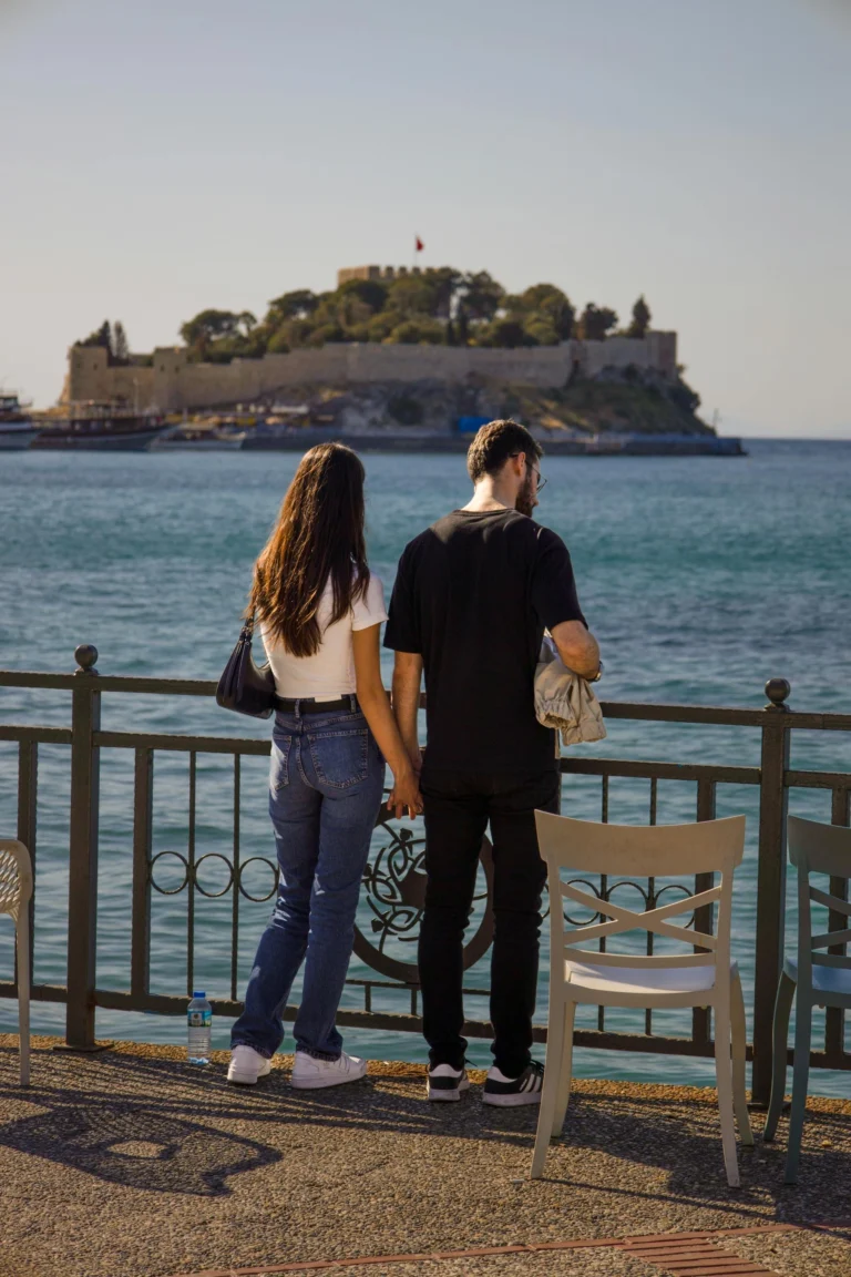 Couple looking at the sea with Pigeon Island view in Kusadasi