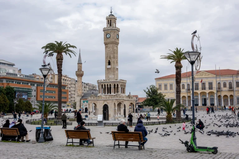 People relaxing near Konak Clock Tower in Izmir square