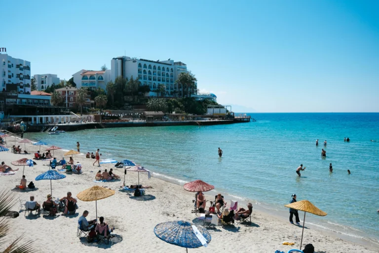 People swimming at Ladies Beach in Kusadasi on a sunny day