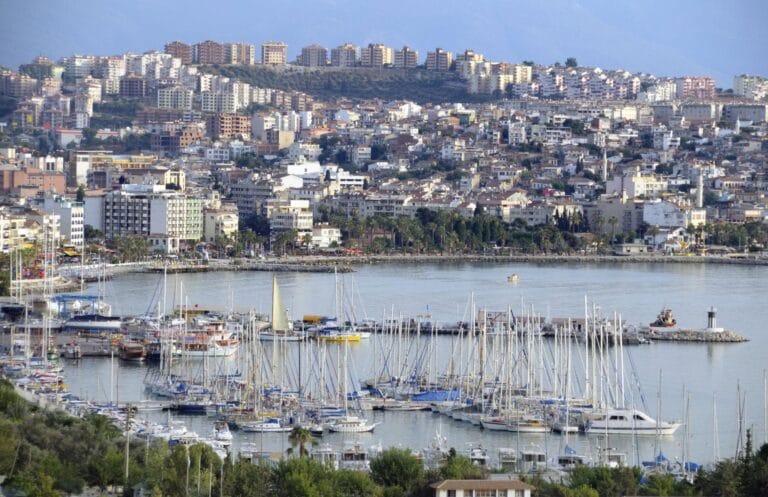 Kusadasi Marina with yachts and coastal city views on the Aegean coast of Turkey
